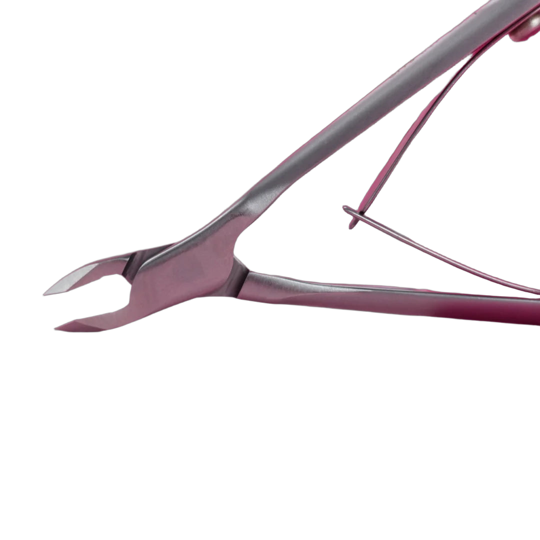 Close-up of the Staleks Smart 10 cuticle nipper with 3mm quarter jaw on a pink background.