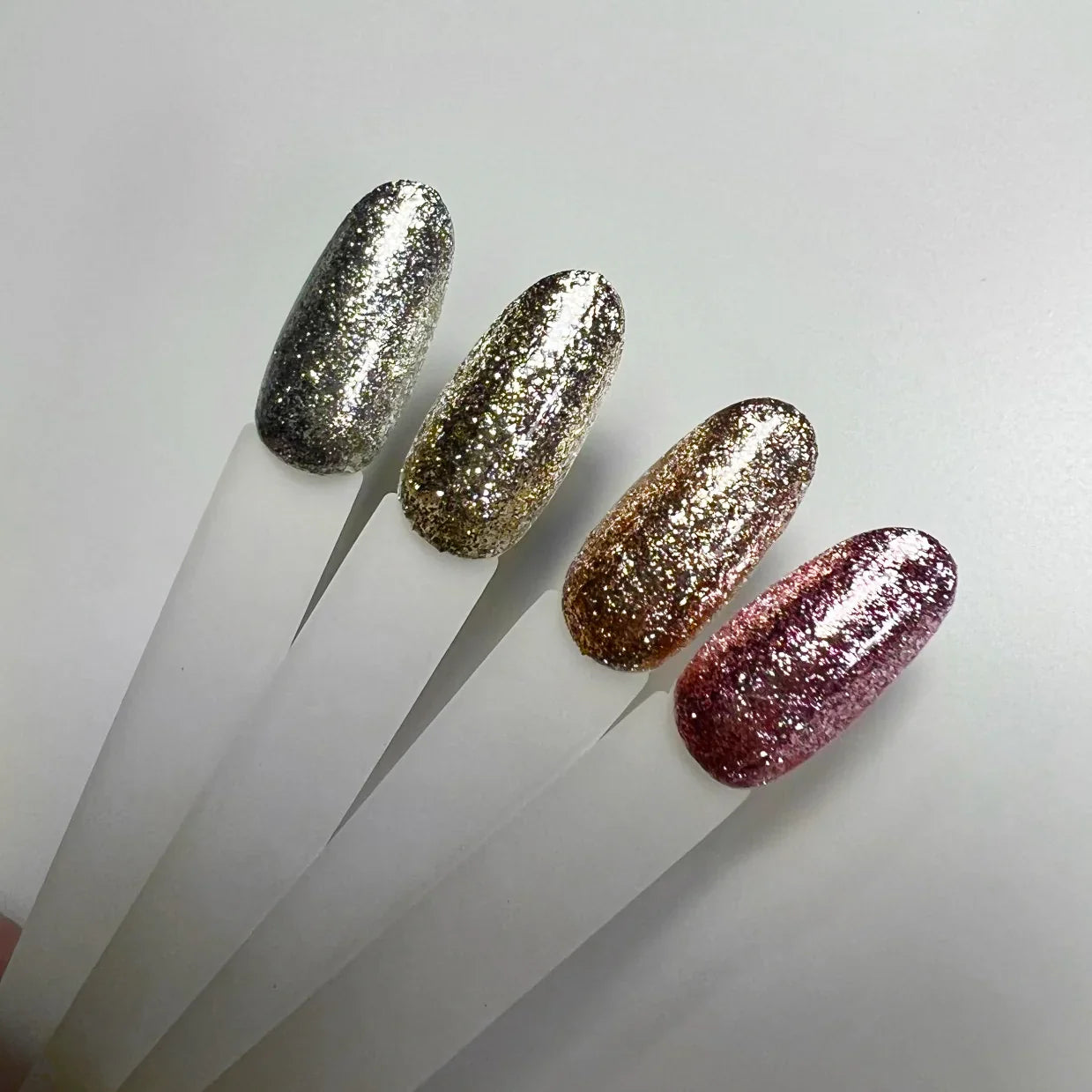 Akzentz Gel-Play Glitz metal-leaf effects on nail swatch sticks