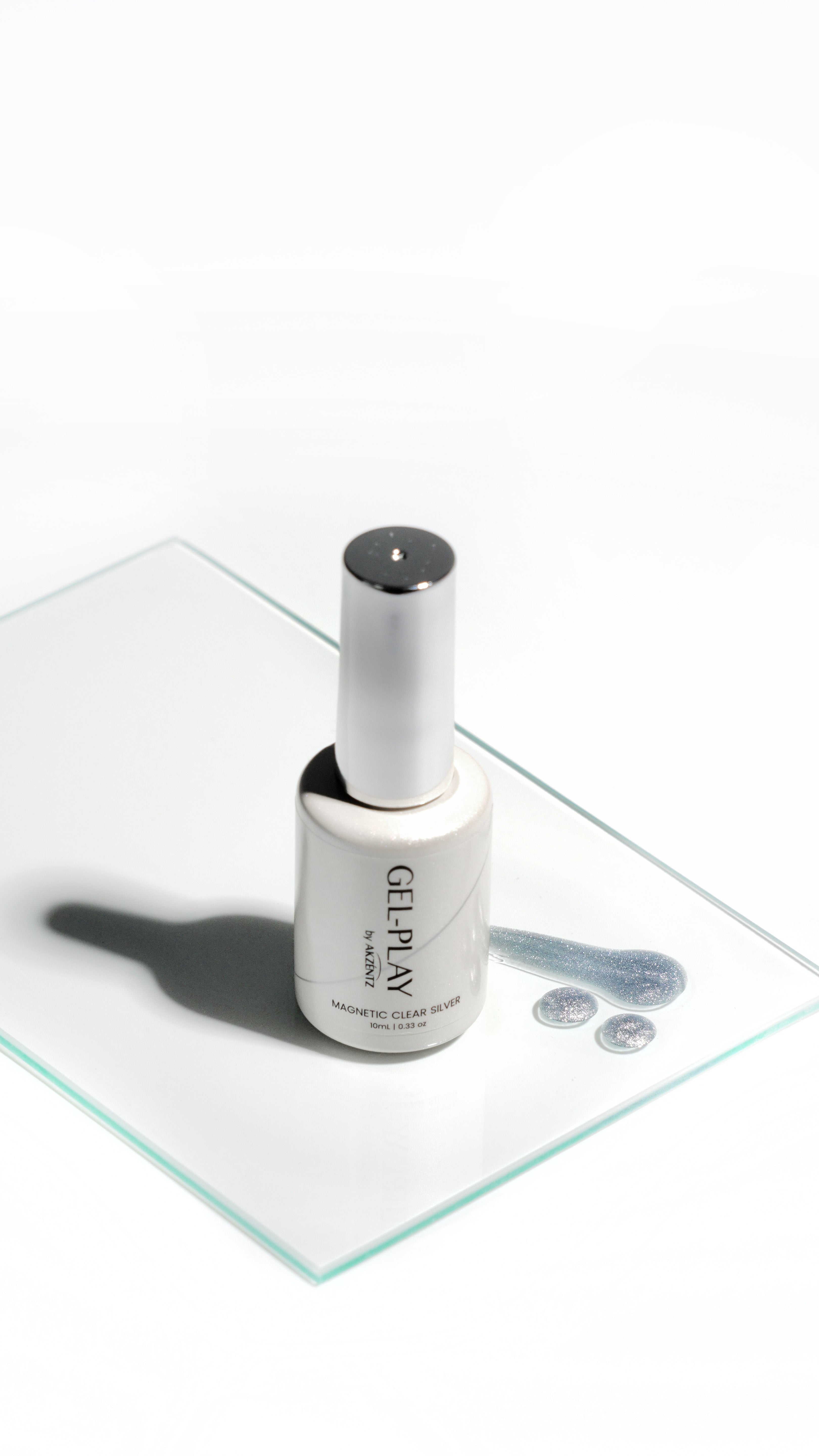 Akzentz Gel-Play Magnetic Clear Silver bottle on glass palette