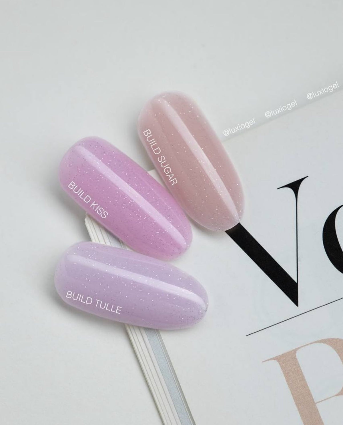 Luxio Build Sparkles Kiss, Sugar, and Tulle nail swatches