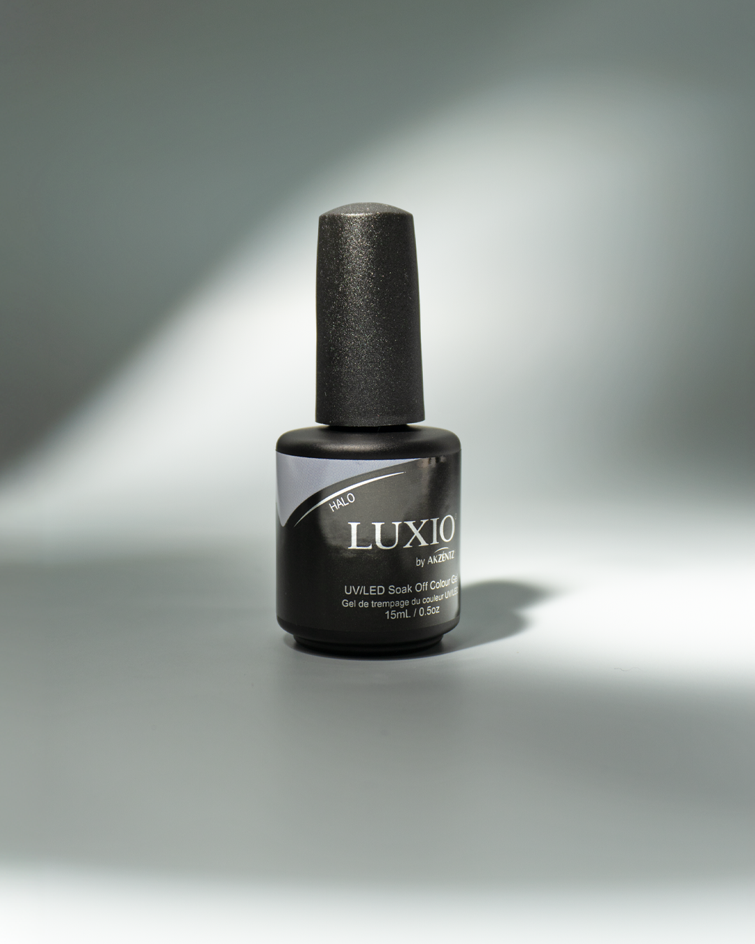 Akzentz Luxio Halo 15 mL gel bottle in manufacturer lifestyle imagery