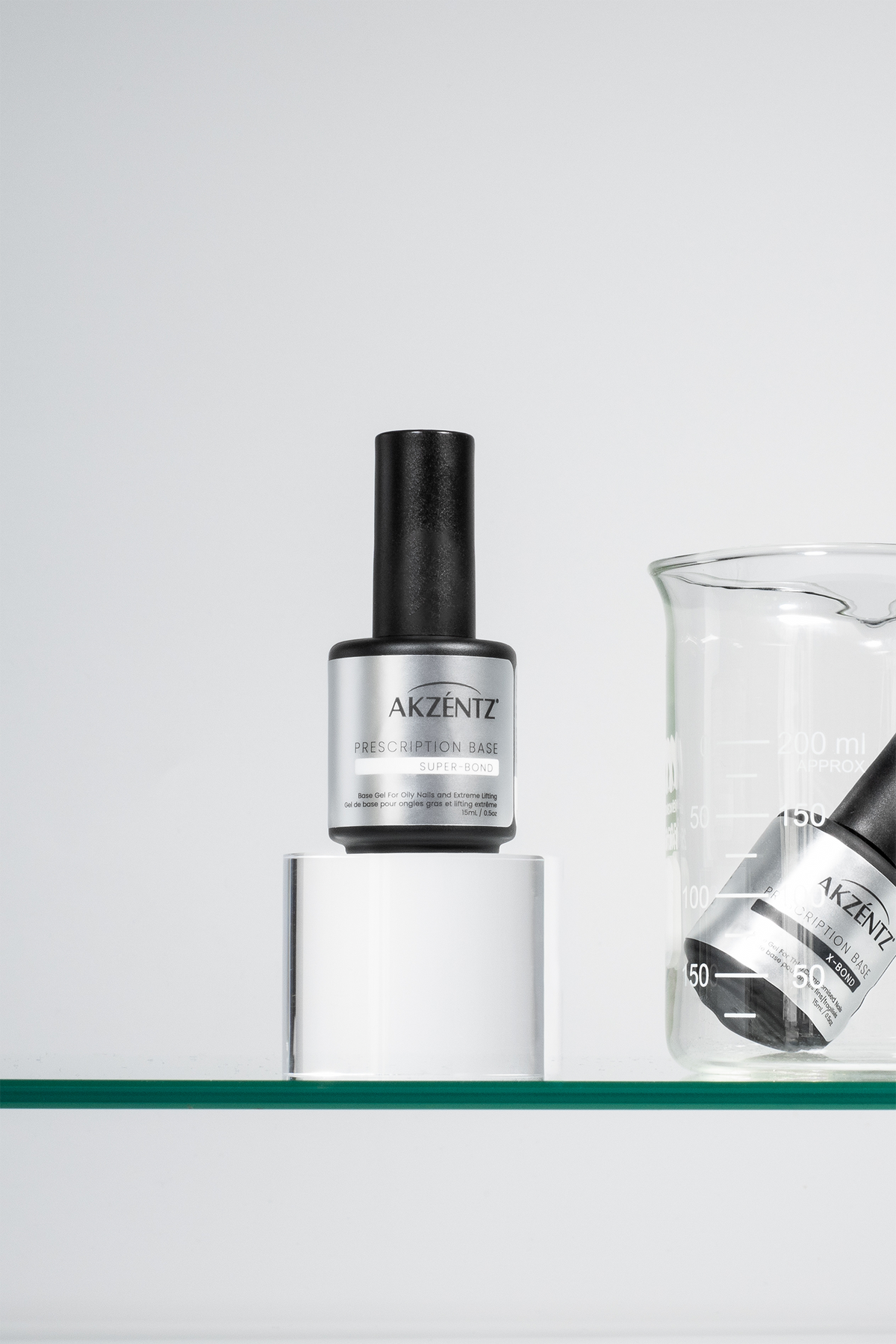 Akzentz Prescription Base Super-Bond 15ml bottle with laboratory glassware