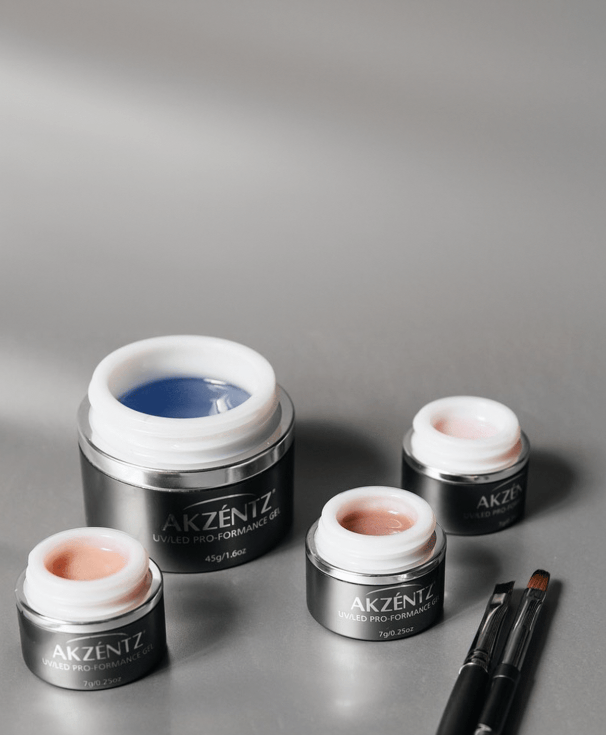 Akzentz Pro-Formance hard gel collection with open gel jars and brush