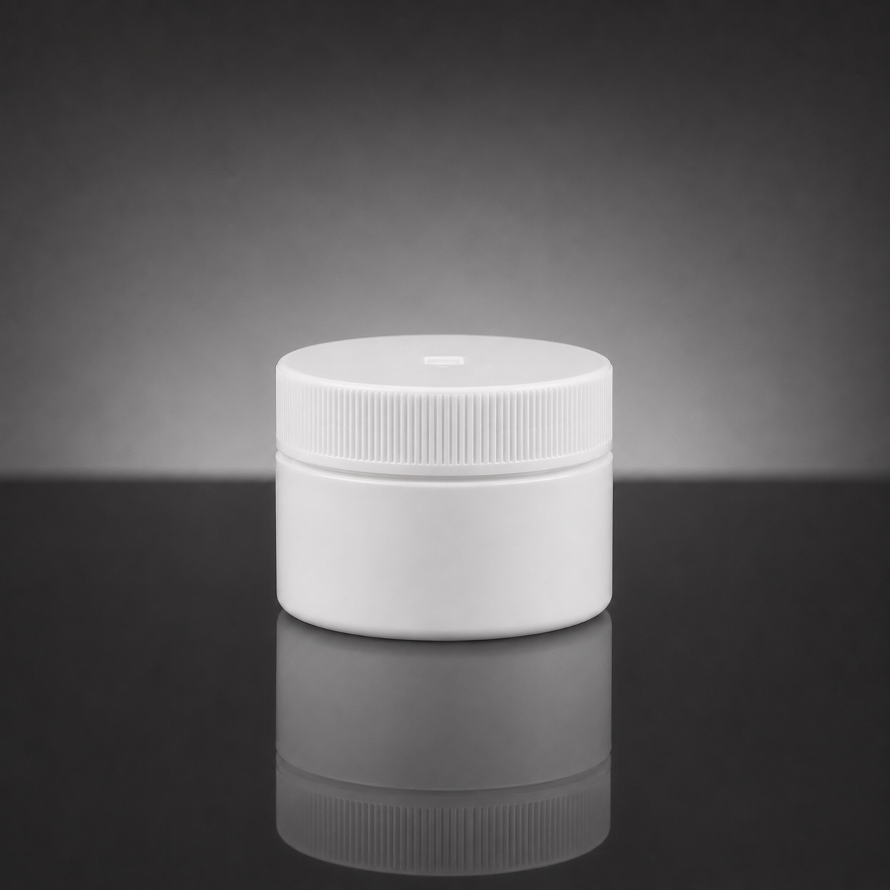 A plain white plastic jar with a ribbed screw-on lid, centered on a dark reflective surface against a gray gradient background.