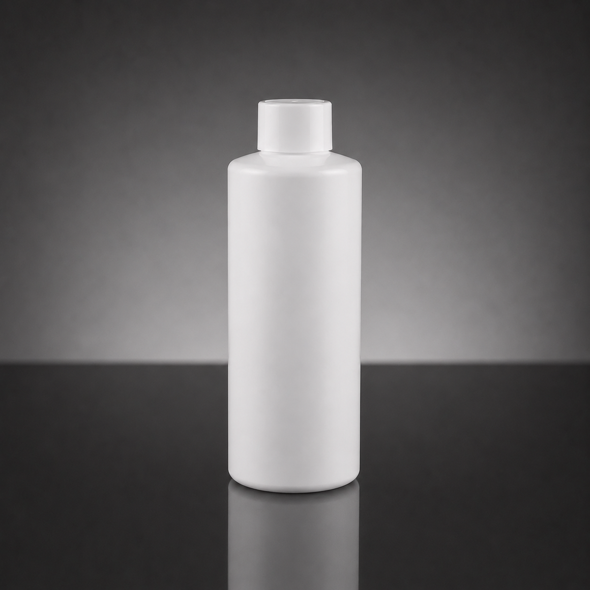 A blank white plastic bottle with a matching screw cap, standing upright on a dark reflective surface against a dark gray gradient background.