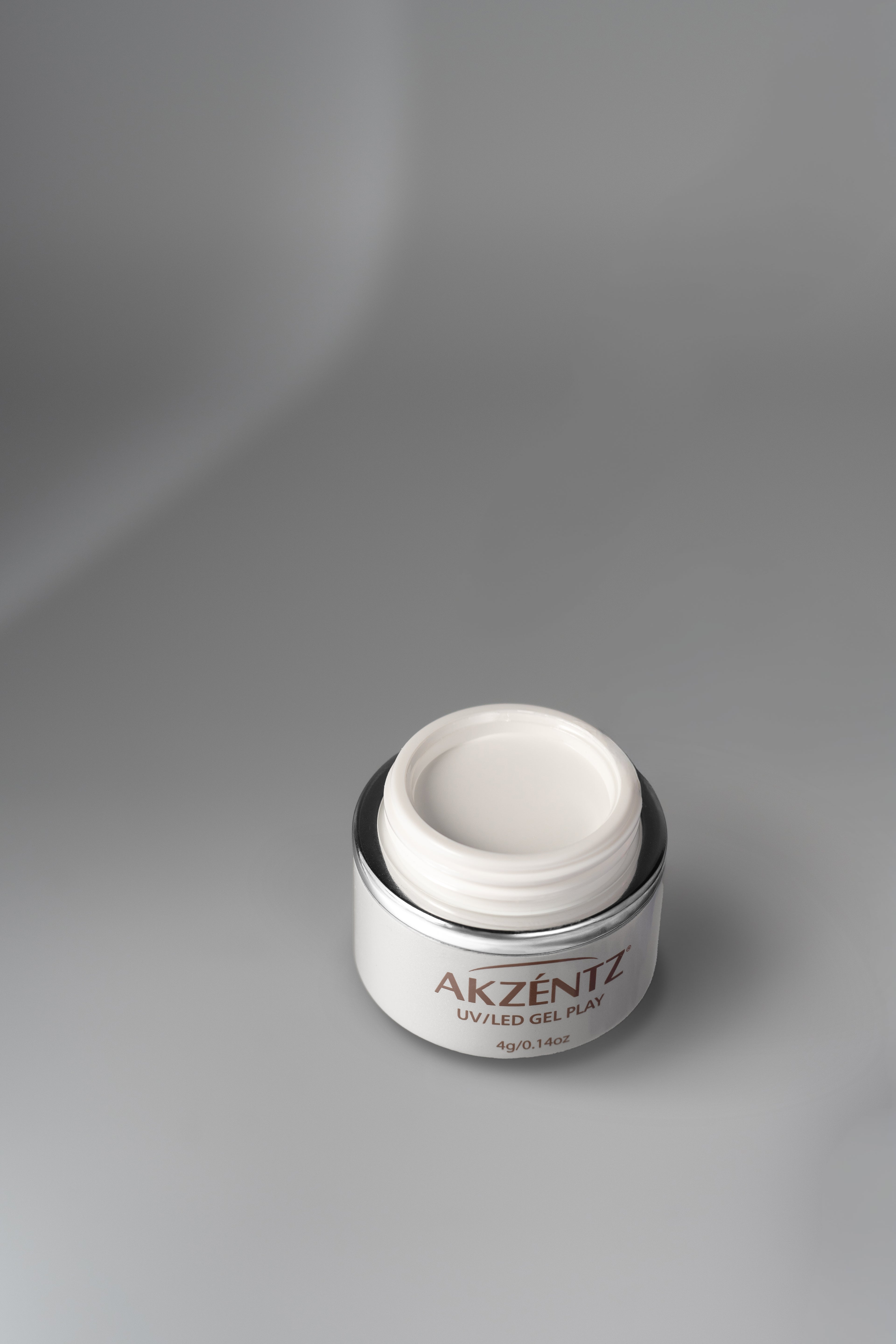 Open 4g jar of Akzentz Gel Play Perfect French White art gel.