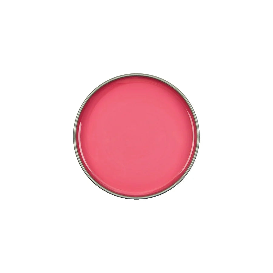 A round metal tin filled with bright pink cream or balm, shown from a top-down view on a plain white background.