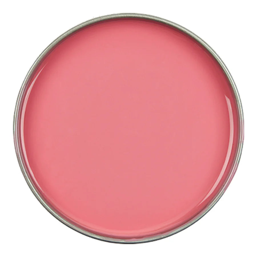 Pink lip balm container on a white background