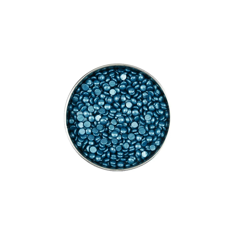 Round container filled with blue beads on a white background