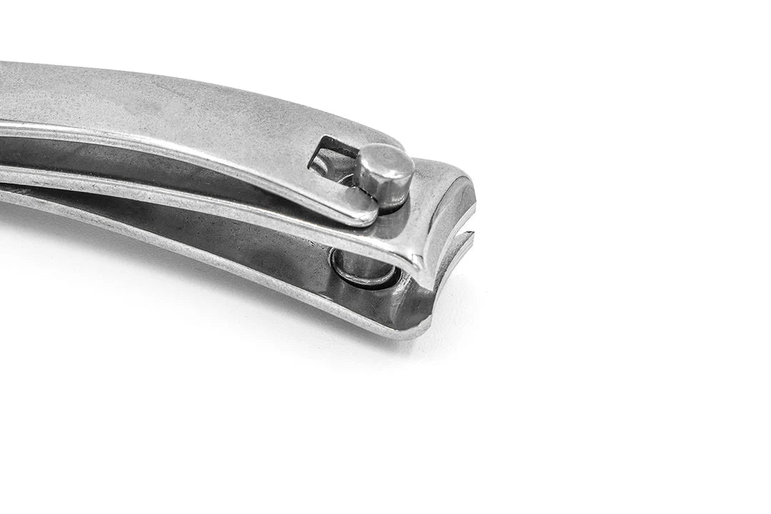 Close-up of a metallic silver nail clipper on a plain white background.