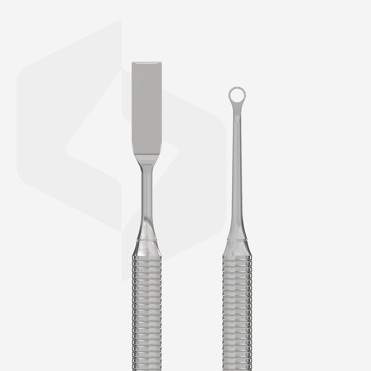 Close-up of the metal ends on a Staleks double-ended cuticle pusher.