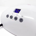 White electronic device with digital display and buttons on a white background