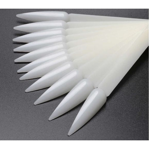 White plastic claws on a gray background