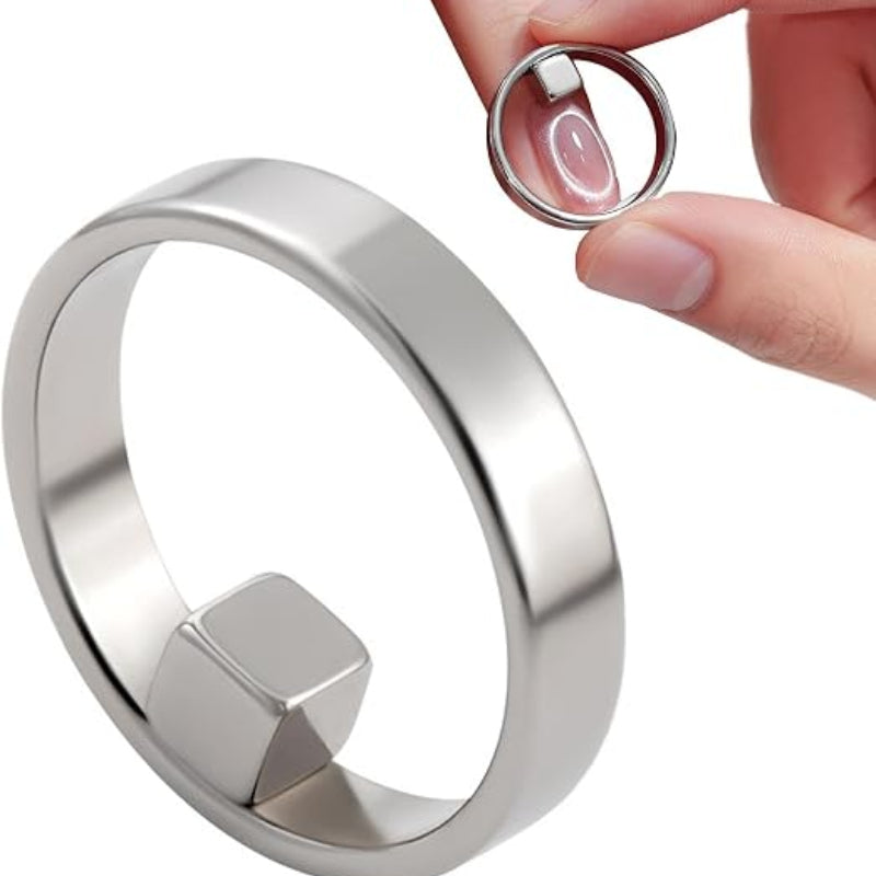 Silver ring with geometric design on a white background