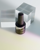 Akzentz Luxio Aura 15 mL gel bottle in manufacturer lifestyle imagery