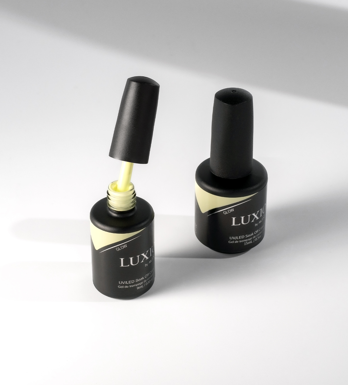 Akzentz Luxio Glow gel polish bottles in a product arrangement