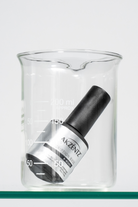 Akzentz Prescription Base X-Bond 15ml bottle in glass beaker