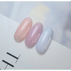Akzentz Enhance Soft Peach, Soft Pink, and Cool White nail swatches