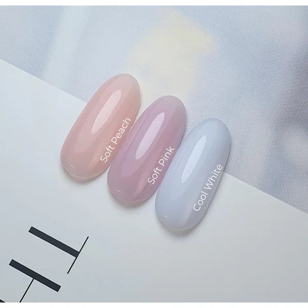 Akzentz Enhance Soft Peach, Soft Pink, and Cool White nail swatches