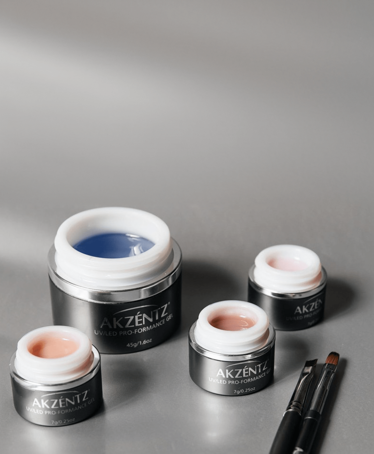 Akzentz Pro-Formance hard gel collection with open gel jars and brush