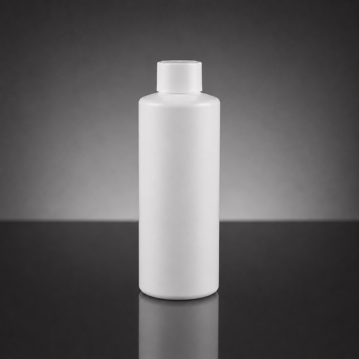 A blank white plastic bottle with a matching screw cap, standing upright on a dark reflective surface against a dark gray gradient background.