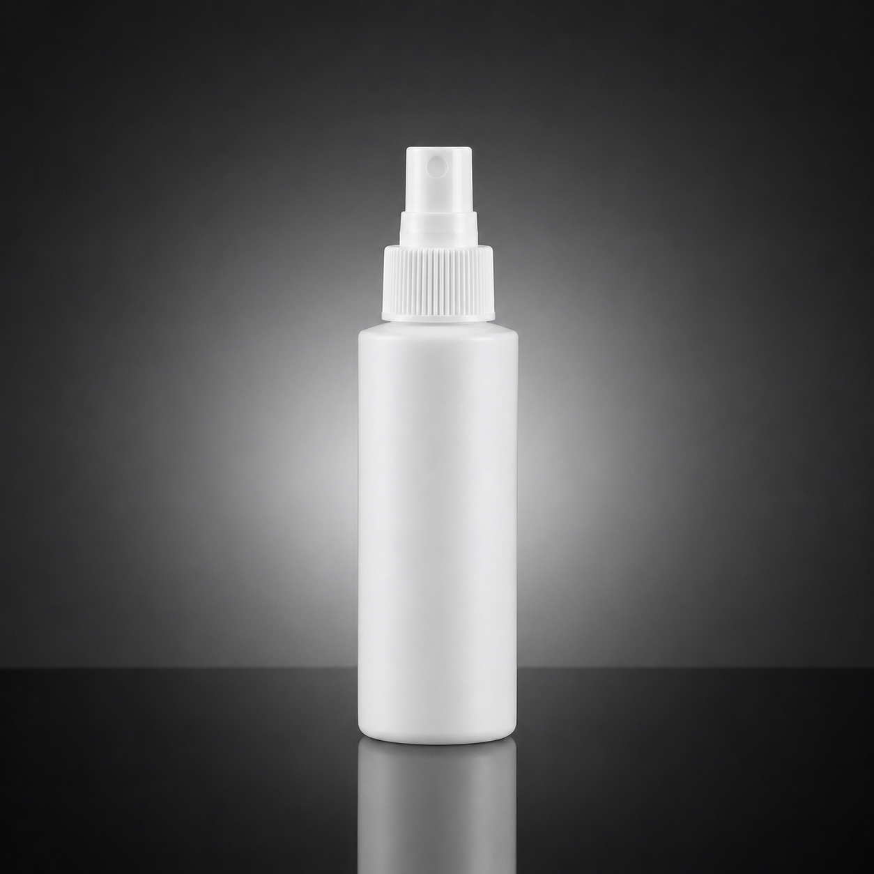 A blank white plastic spray bottle with a ribbed cap, standing upright on a reflective black surface against a dark gray gradient background.