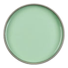 Round green ceramic plate on a white background