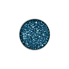 Round container filled with blue beads on a white background