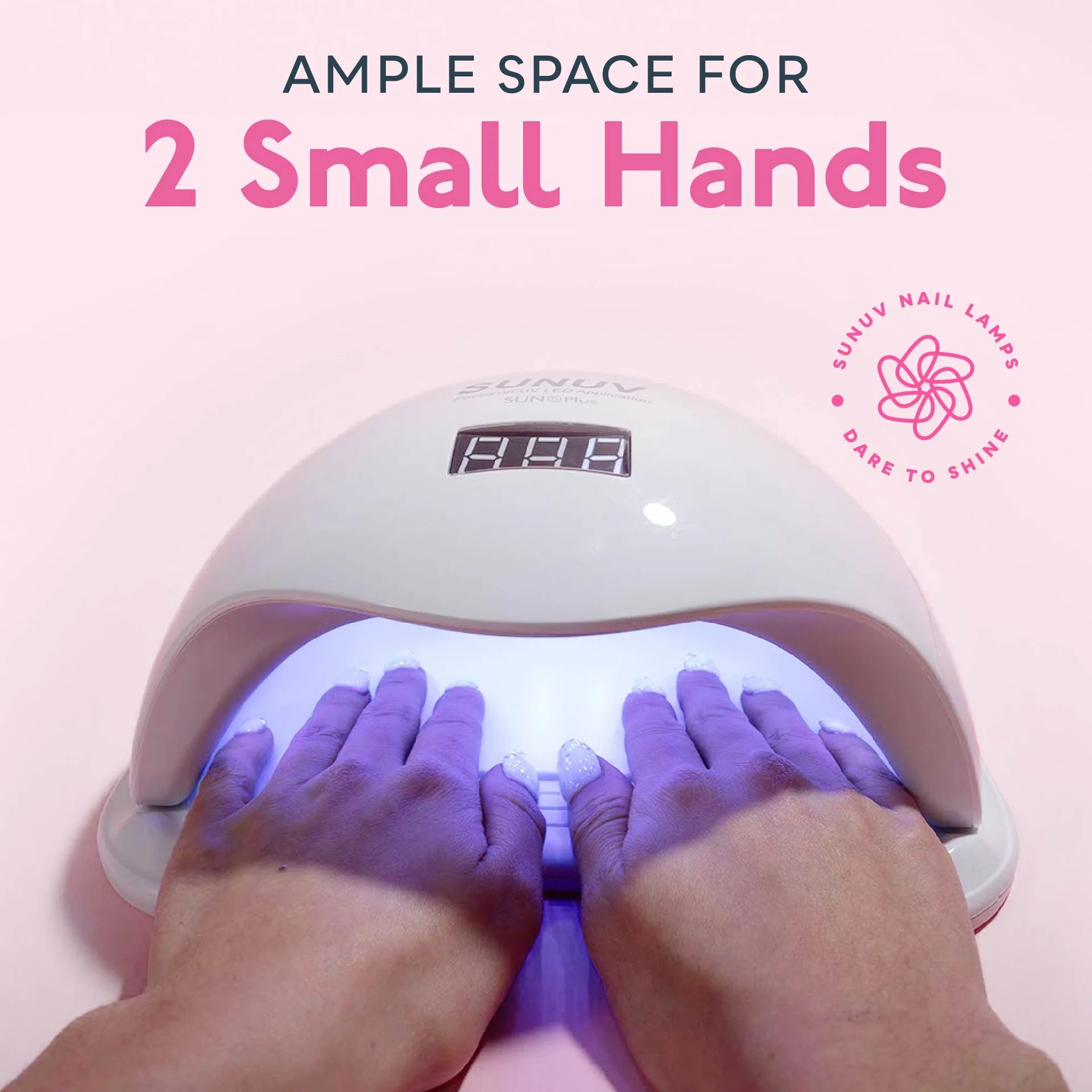 Person using a nail lamp with text indicating ample space for two small hands on a pink background.