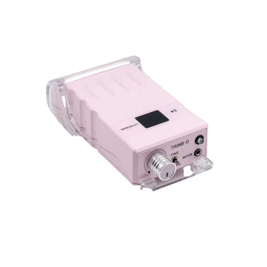 A pink portable electronic device with a clear protective case, featuring a rotary knob, power buttons, and a small display screen, photographed on a light gray background.