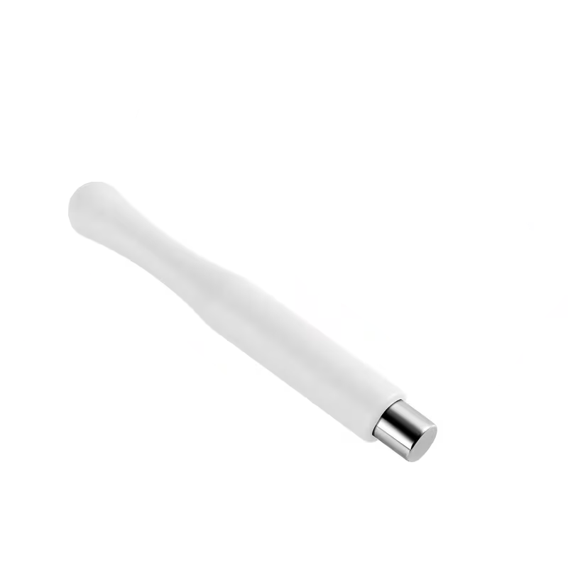 White cylindrical object with a silver accent on a white background