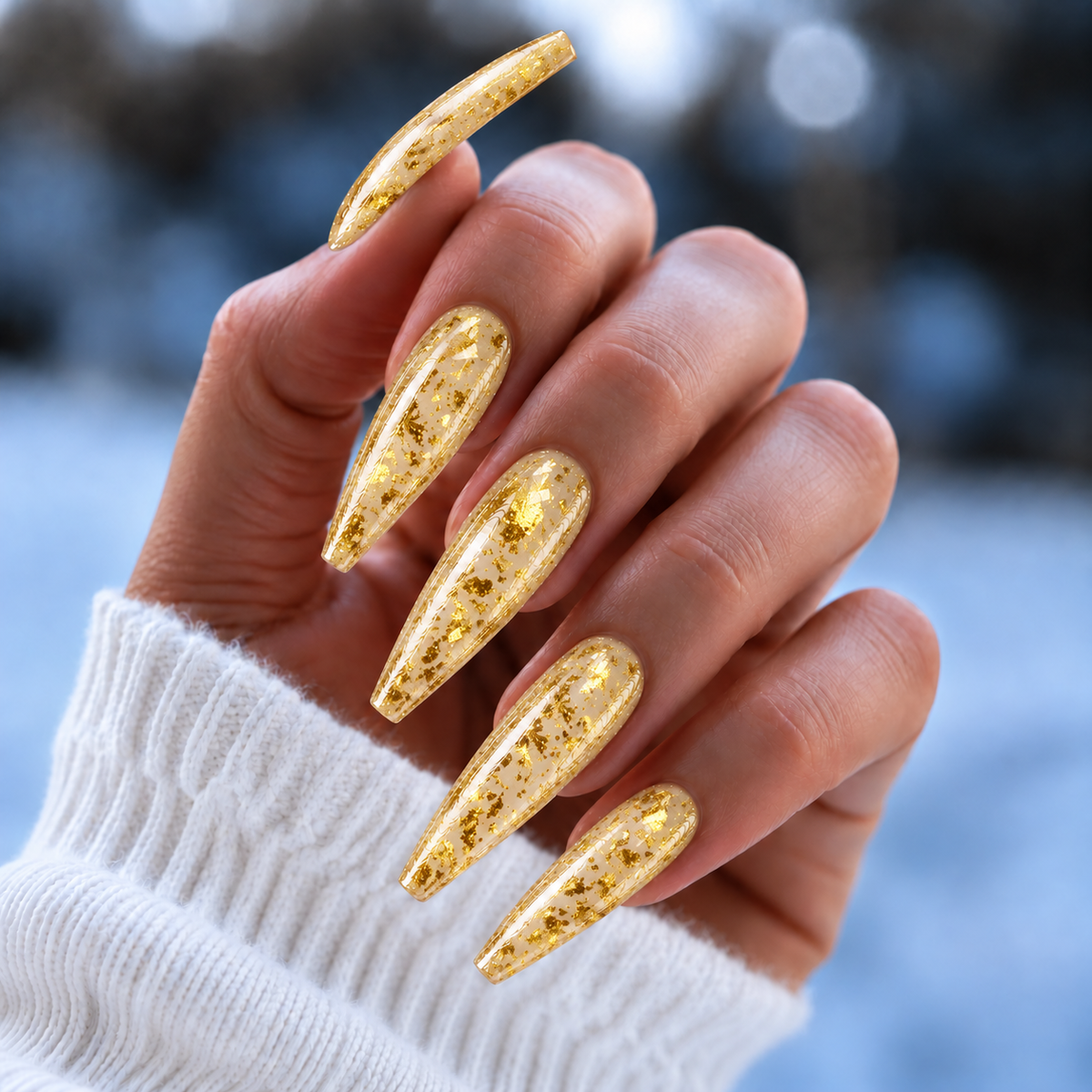 BEMI Chrome Solar Flakes nails in a color photo.