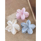 Coconoir Beauty blue, pink, and white flower hair claw clips displayed together