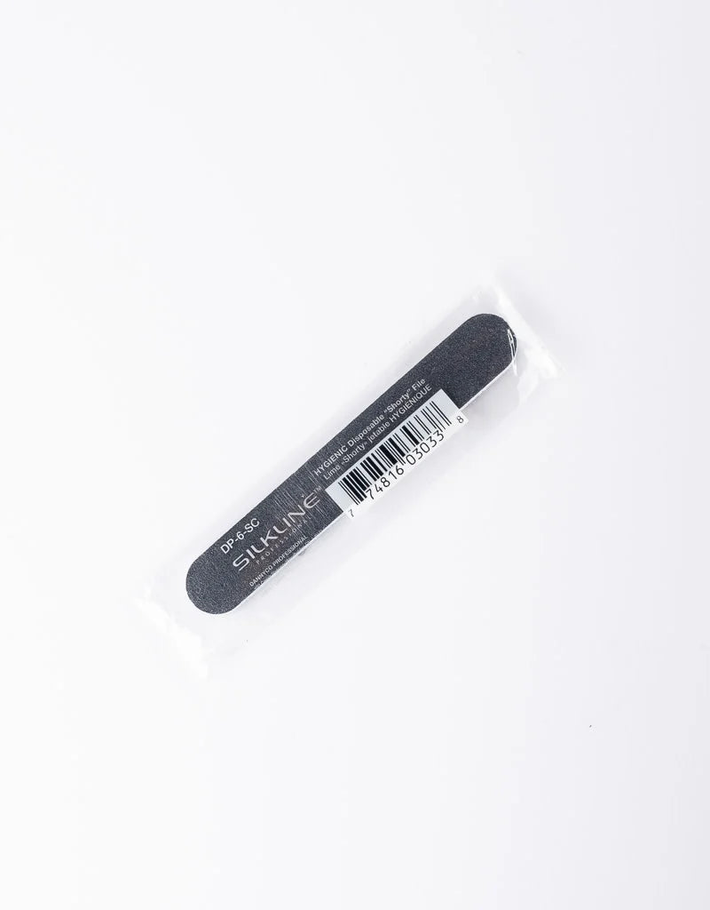 A black nail file with white text reading 'STAINLINE' and a barcode, sealed in a clear plastic sleeve on a white background.