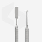 Close-up of the metal ends on a Staleks double-ended cuticle pusher.