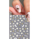 Coconoir Beauty Bees and Daisies nail decals shown with a matching manicure