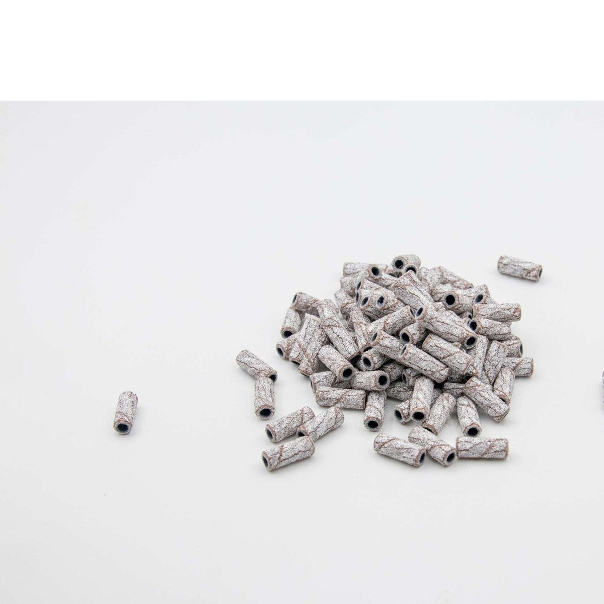 U-Tools Mini White coarse 80-grit sanding bands, 3 x 12.7 mm, loose bands on a white background.